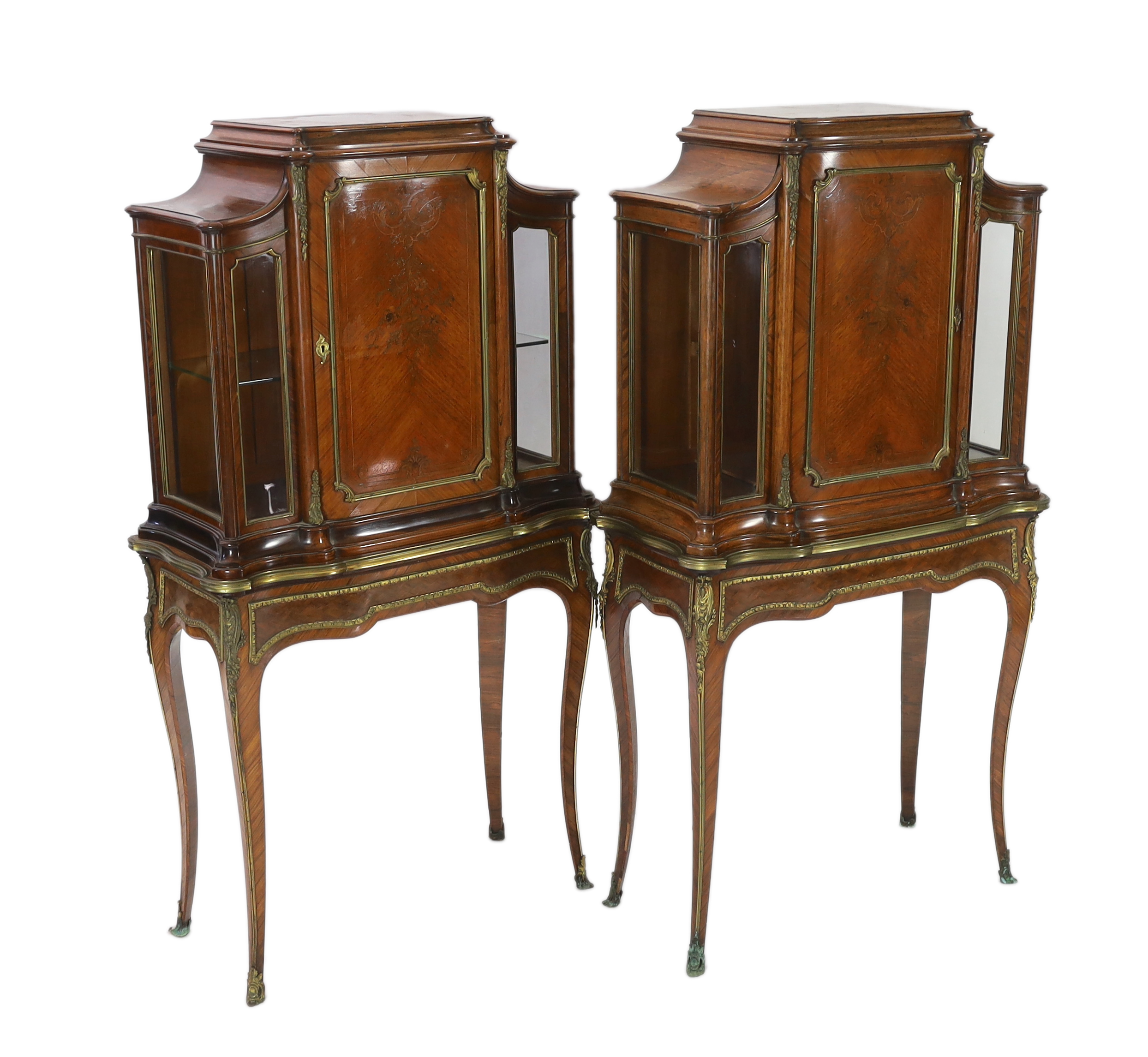 A pair of late 19th century Louis XVI style marquetry inlaid kingwood vitrines